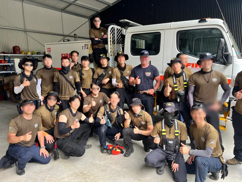 An international cohort with T7-4 in the engine bay at the Hunter Valley base.