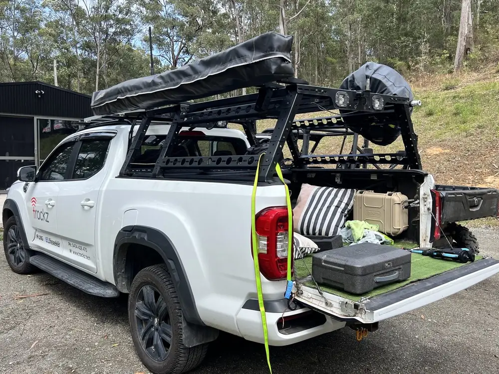A ute rigged with a roof cradle for the drone and its cases: the mobile drone unit.