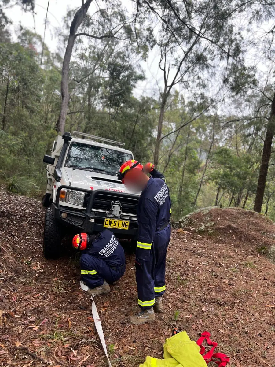 Running a hose line from a 4x4 appliance on a bush track.